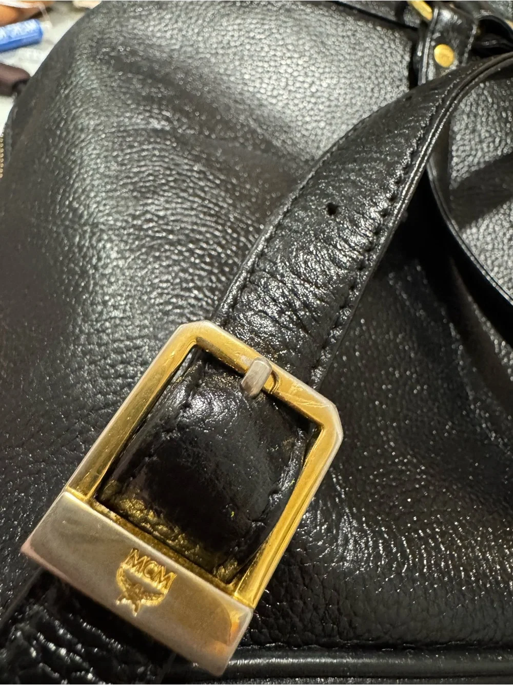 MCM Black Leather Backpack with Gold Logo Accents